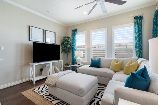 living area featuring a ceiling fan, baseboards, dark wood finished floors, and crown molding