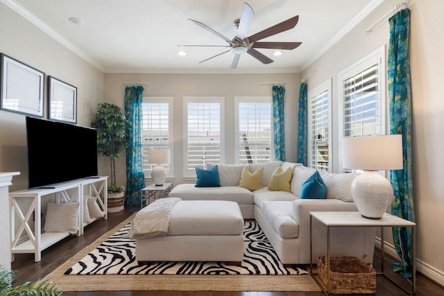 living area with dark wood-style floors, ornamental molding, and a healthy amount of sunlight