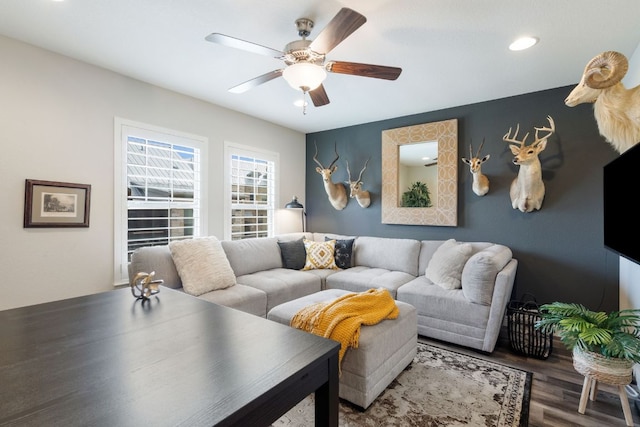 1209 Highknoll Ln, Georgetown, TX 78628 - living area featuring wood finished floors, a ceiling fan, and recessed lighting