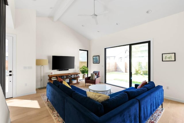 living room with baseboards, light wood-style flooring, high vaulted ceiling, and beamed ceiling