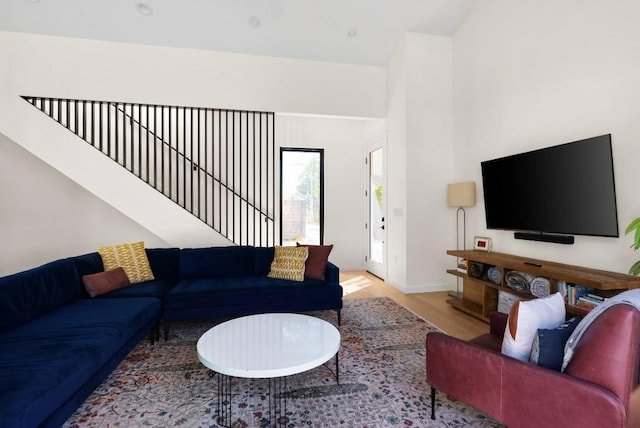 living room featuring wood finished floors and baseboards