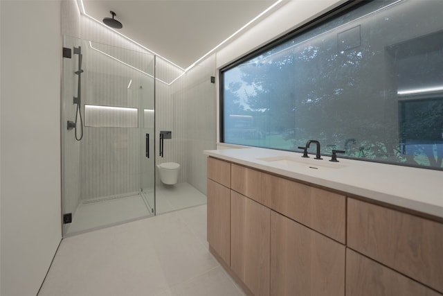 full bathroom featuring a stall shower, toilet, tile patterned flooring, vanity, and tile walls