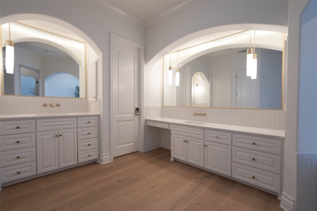 full bathroom with wood finished floors, vanity, and crown molding