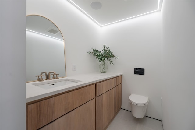 bathroom with visible vents, vanity, toilet, and tile patterned floors