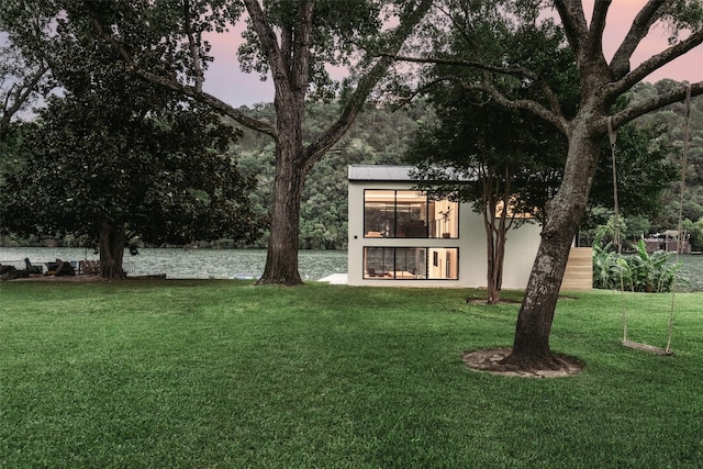 2301 Manana St, Austin, TX 78730 - yard at dusk featuring a yard and a water view