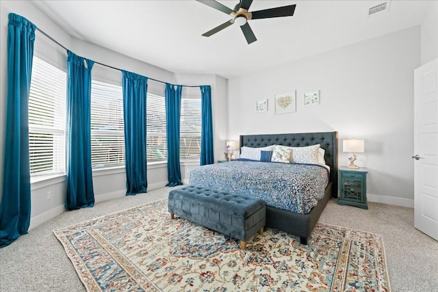 bedroom with a ceiling fan, carpet, visible vents, and baseboards