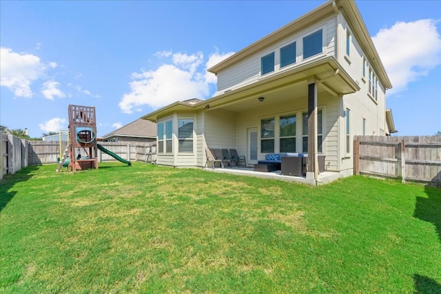 back of property featuring a patio area, a yard, a playground, and a fenced backyard