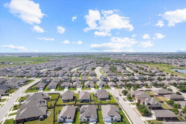 bird's eye view with a water view and a residential view