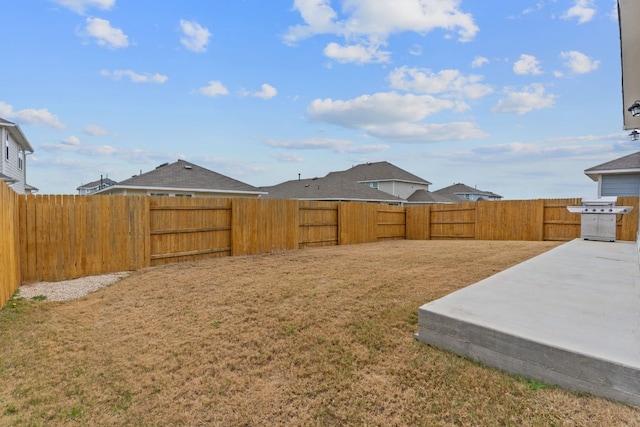 view of yard featuring a patio and a fenced backyard