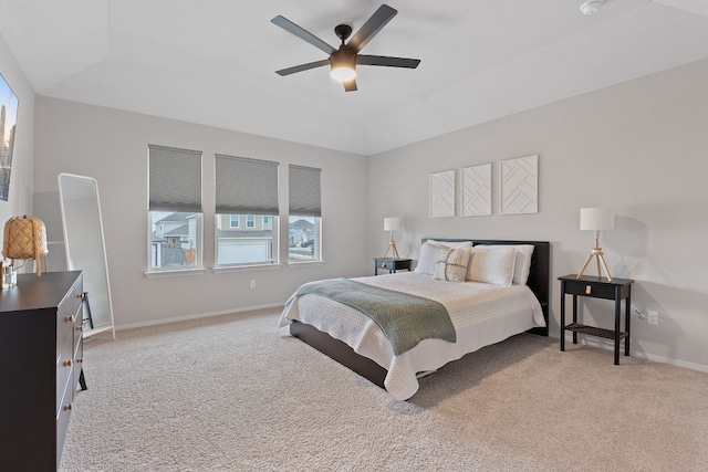 bedroom with baseboards, a ceiling fan, and light colored carpet