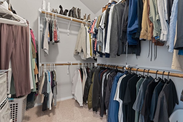 walk in closet featuring carpet floors