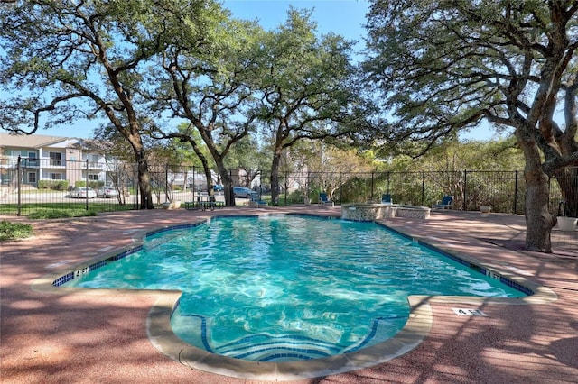 pool featuring a patio and fence