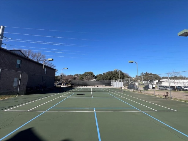 view of sport court with community basketball court and fence