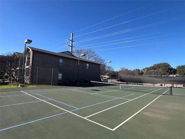 view of sport court with community basketball court and fence