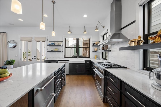 kitchen featuring dark wood-style flooring, a sink, open shelves, stainless steel range, and island exhaust hood