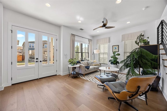 living area featuring recessed lighting, visible vents, a ceiling fan, french doors, and hardwood / wood-style floors