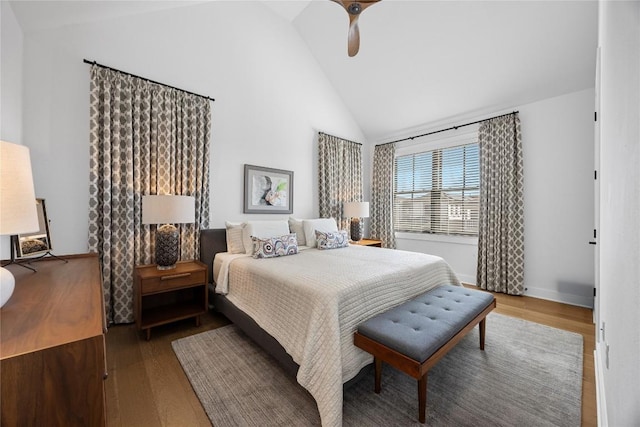 bedroom featuring high vaulted ceiling, ceiling fan, baseboards, and wood finished floors