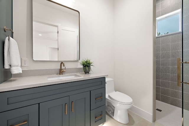 full bath featuring toilet, tile patterned floors, tiled shower, and vanity