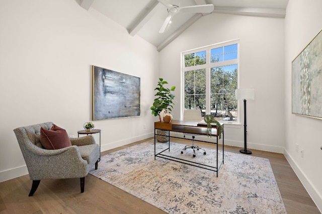 office space featuring beam ceiling, a ceiling fan, wood finished floors, high vaulted ceiling, and baseboards