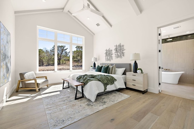 bedroom featuring visible vents, high vaulted ceiling, wood finished floors, and beam ceiling