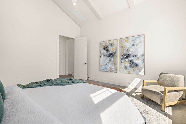 bedroom with baseboards, high vaulted ceiling, beamed ceiling, and wood finished floors