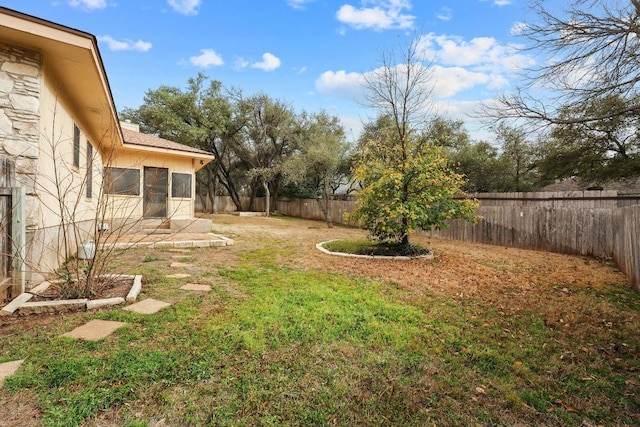 view of yard with a fenced backyard