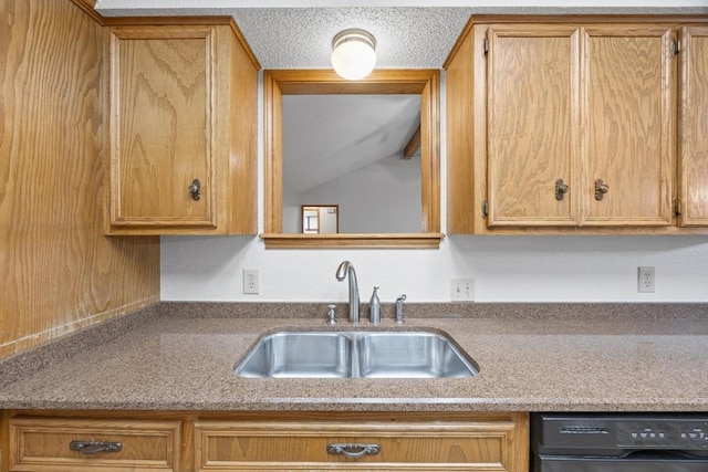 kitchen with black dishwasher, light countertops, and a sink