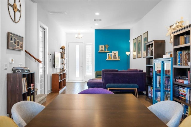 dining area featuring visible vents, a chandelier, wood finished floors, and recessed lighting