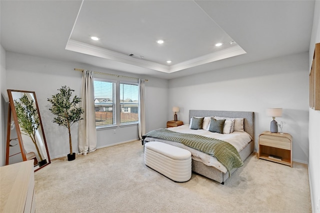 bedroom with light carpet, a raised ceiling, and recessed lighting