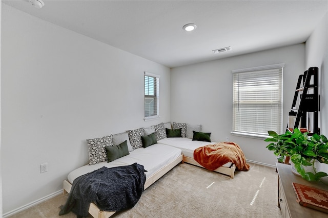 bedroom with baseboards, visible vents, and carpet flooring