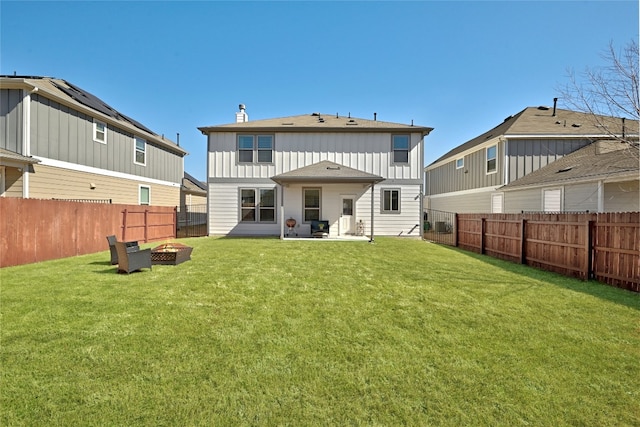 6808 Ellsworth Walk, Austin, TX 78724 - rear view of property featuring a fire pit, board and batten siding, a fenced backyard, and a patio