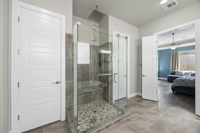 ensuite bathroom with a stall shower, baseboards, visible vents, and ensuite bathroom