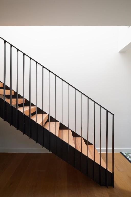2703 Pegram Ave, Austin, TX 78757 - staircase with wood finished floors