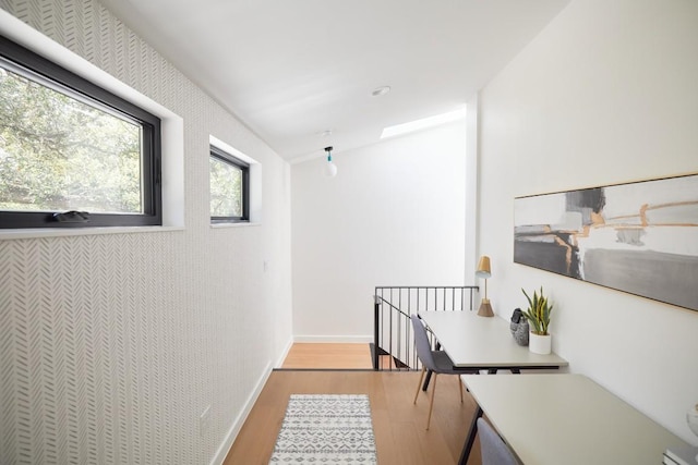 2703 Pegram Ave, Austin, TX 78757 - corridor with wood finished floors and an upstairs landing