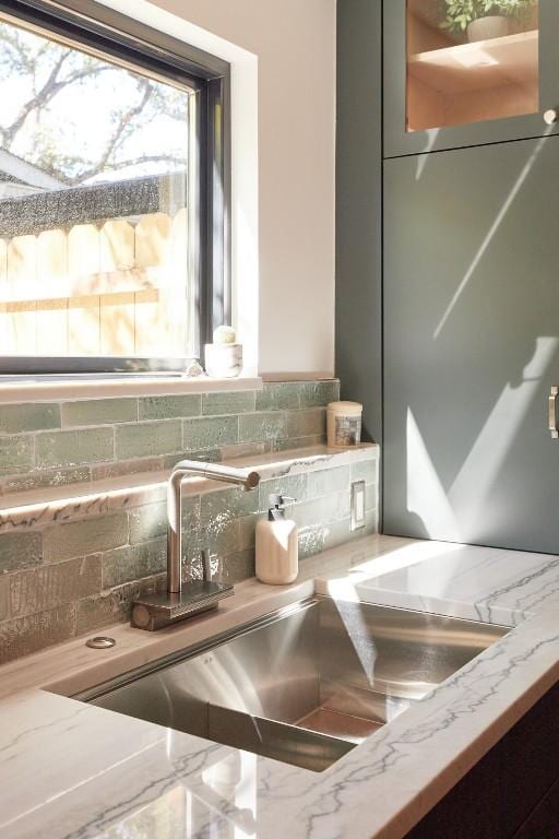 2703 Pegram Ave, Austin, TX 78757 - detailed view of a sink, backsplash, and light stone counters