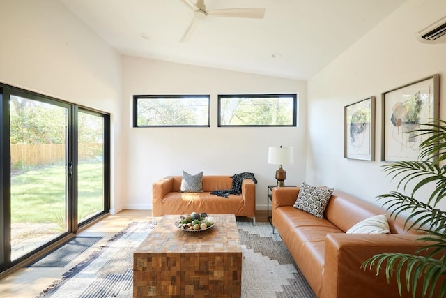 2703 Pegram Ave, Austin, TX 78757 - living area featuring vaulted ceiling, light wood finished floors, an AC wall unit, a ceiling fan, and baseboards