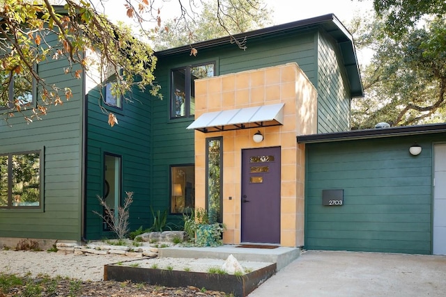 2703 Pegram Ave, Austin, TX 78757 - view of front facade featuring driveway