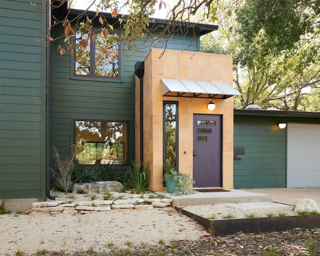 2703 Pegram Ave, Austin, TX 78757 - view of front of property with a garage and driveway