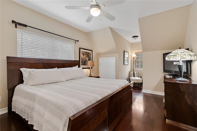 bedroom featuring lofted ceiling, ceiling fan, baseboards, and dark wood-type flooring