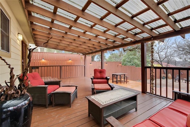 wooden deck featuring fence, an outdoor living space, and a pergola