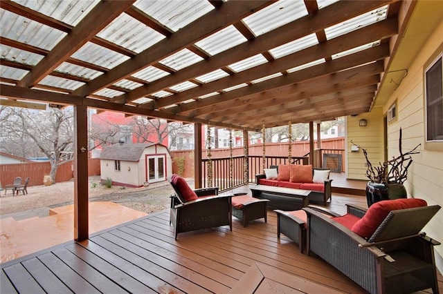 deck with fence, an outdoor living space, a pergola, and an outdoor structure