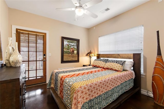 bedroom featuring a ceiling fan, visible vents, and baseboards