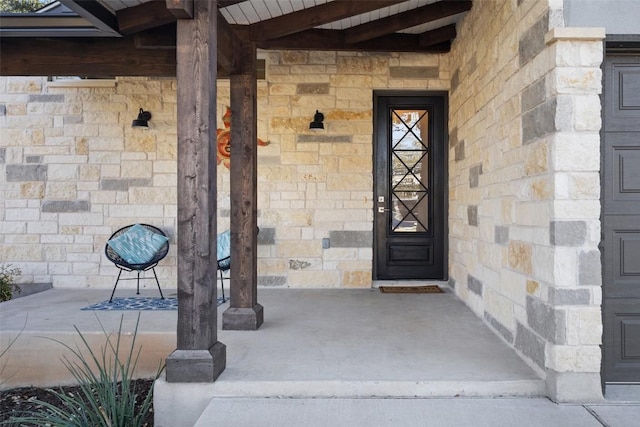 property entrance with stone siding