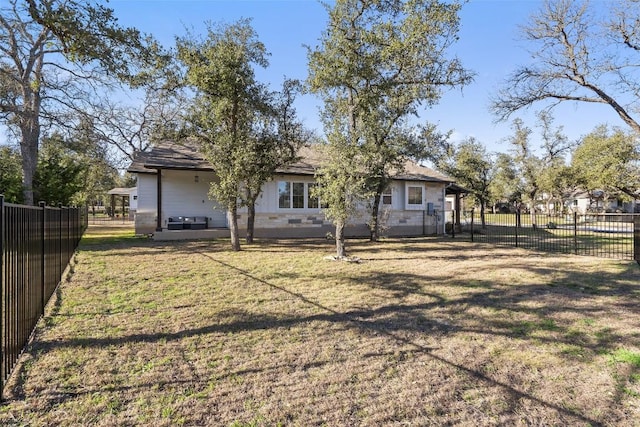 exterior space featuring a patio, a lawn, and a fenced backyard