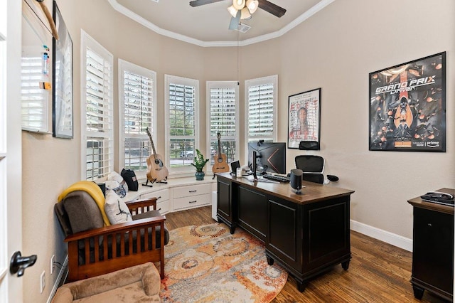 office space featuring a ceiling fan, baseboards, ornamental molding, and wood finished floors