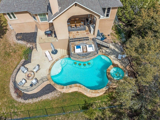 view of pool featuring fence