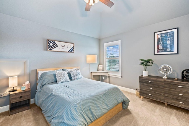 carpeted bedroom with lofted ceiling, baseboards, and a ceiling fan