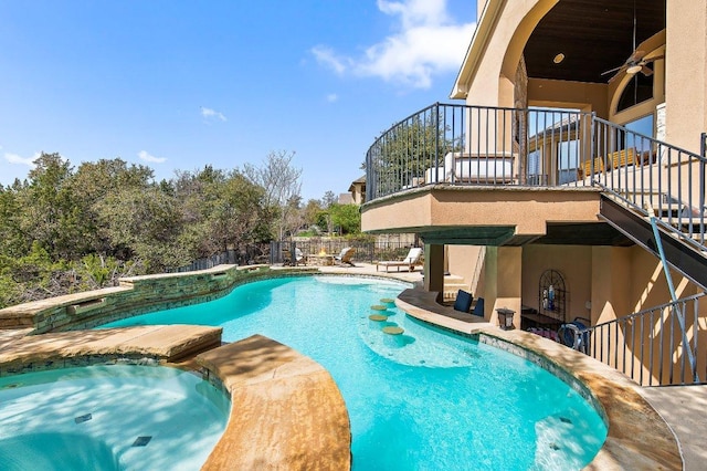 view of pool with ceiling fan, a fenced in pool, a patio, and an in ground hot tub