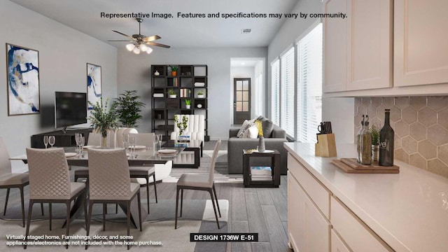 dining room featuring ceiling fan and light wood-style floors