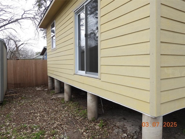 view of property exterior with fence